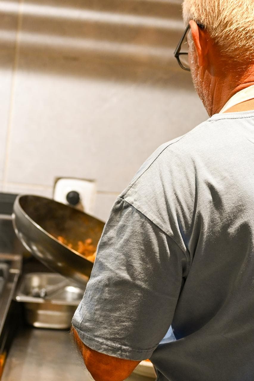 A pan on the flame in the Mikri Avra kitchen.